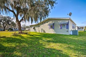 a house with a tree in a yard at Wildwood Vacation Rental Near Golf and Dining! in Wildwood