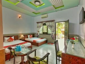 Giường trong phòng chung tại Thanh Dat Resort