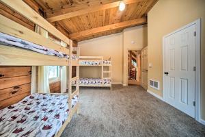 a bedroom with bunk beds in a house at Cabin in Lake Chautauqua on 36 Acres with Hot Tub! in Ashville