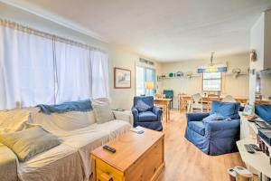 a living room with a couch and two chairs at Cozy Waterfront Cottage on Montsweag Bay! in Westport
