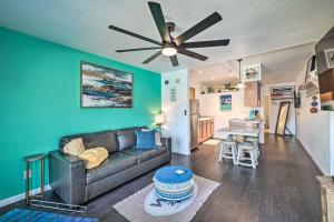 a living room with a couch and a ceiling fan at Parker Studio Nestled on the Colorado River! in Parker
