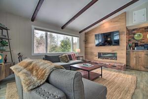 a living room with a couch and a fireplace at Inviting Vermont Cabin On Mount Ascutney! in Brownsville