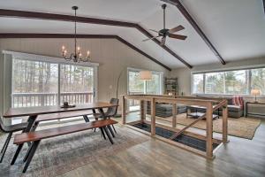 a dining room with a table and a couch at Inviting Vermont Cabin On Mount Ascutney! in Brownsville