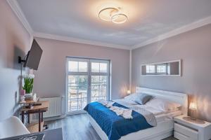 Ein Bett oder Betten in einem Zimmer der Unterkunft Baltic Home