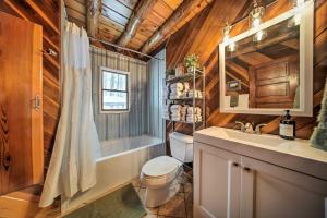 a bathroom with a toilet and a sink at Cambridge Springs Cabin Near French Creek! in Cambridge Springs +18 photos