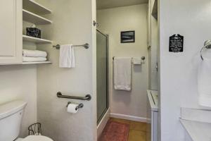 a bathroom with a shower and a toilet and towels at Peaceful Pet-Friendly Payson Vacation Rental in Payson