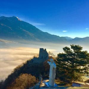 a statue of a man standing on top of a castle at Komplettes Hotel mit 10 Zimmern in Bad Ragaz