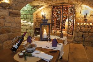 a dining room with two tables with wine bottles at Laasenhof in Struppen