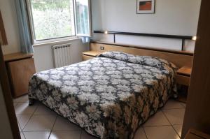 Ένα ή περισσότερα κρεβάτια σε δωμάτιο στο Albergo Di Murlo
