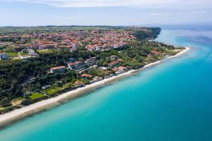 an aerial view of a resort on the beach at VagAthan - Lux Holidays in Afitos