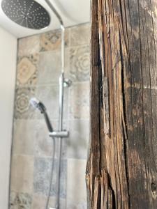 a bathroom with a shower with a wooden counter top at Quinta da Boa Sorte in Estói +17 photos
