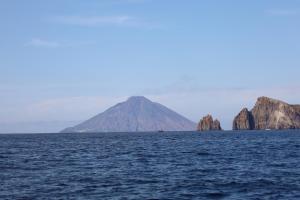 a mountain in the middle of a large body of water at Art B&B in Panarea