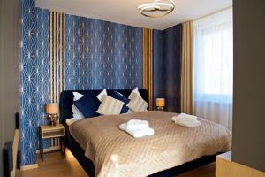 Posteľ alebo postele v izbe v ubytovaní CITY PRESTIGE apartment Trencin