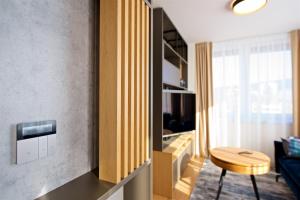 Televízia a/alebo spoločenská miestnosť v ubytovaní CITY PRESTIGE apartment Trencin