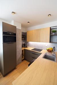 Kuchyňa alebo kuchynka v ubytovaní CITY PRESTIGE apartment Trencin