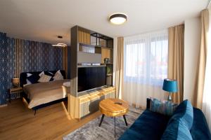 Televízia a/alebo spoločenská miestnosť v ubytovaní CITY PRESTIGE apartment Trencin