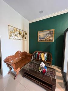 a living room with a couch and a table at Dshomestay in Temerloh