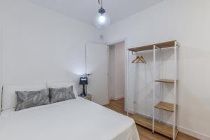 Łóżko lub łóżka w pokoju w obiekcie MyHouseSpain - Moderno apartamento ubicación inmejorable Madrid