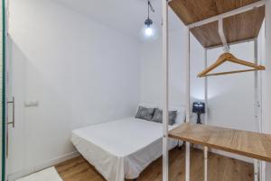 Łóżko lub łóżka w pokoju w obiekcie MyHouseSpain - Moderno apartamento ubicación inmejorable Madrid