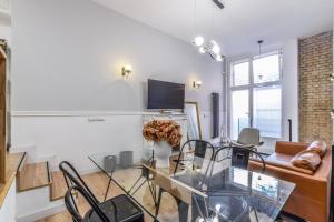Telewizja i/lub zestaw kina domowego w obiekcie MyHouseSpain - Moderno apartamento ubicación inmejorable Madrid