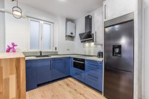 Kuchnia lub aneks kuchenny w obiekcie MyHouseSpain - Moderno apartamento ubicación inmejorable Madrid