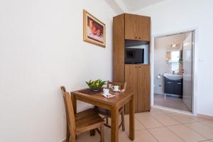 a small table and chair in a room at Amazing view apartment Slavica 3 in Dubrovnik