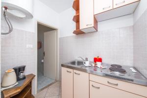 a kitchen with a sink and a counter top at Amazing view apartment Slavica 3 in Dubrovnik