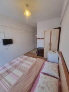Postel nebo postele na pokoji v ubytování Thermal Orkide Pansiyon