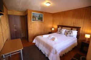 Giường trong phòng chung tại Hospedaje Icalma