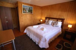 Giường trong phòng chung tại Hospedaje Icalma +6 ảnh