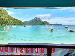 a view of a bay with boats in the water at Gracias Place in El Nido