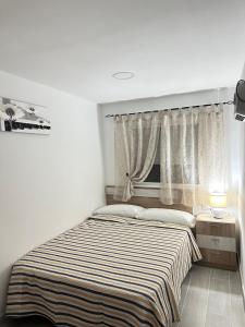 Posteľ alebo postele v izbe v ubytovaní Apartamento FELICIA