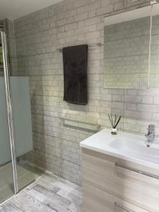 a bathroom with a sink and a mirror at Cozy apartment in Los Cristianos in El Guincho