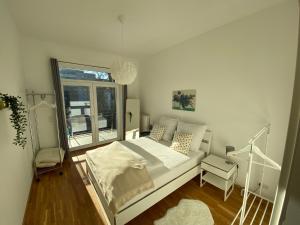a bedroom with a large bed and a window at Wohnung in Bayreuths schönster Straße in Bayreuth