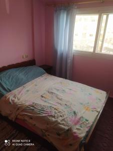 Tempat tidur dalam kamar di N23 Residence Amine pour famille