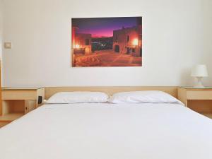 A bed or beds in a room at Ligure Residence