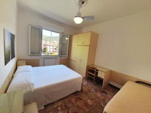 A bed or beds in a room at Ligure Residence