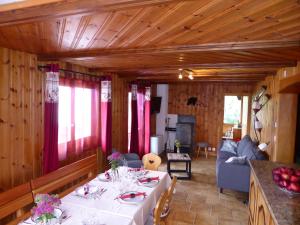 a living room with a table and a couch at Chant du Torrent: 12 pers. idéal pour les familles in Nendaz