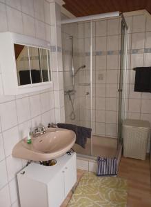 a bathroom with a sink and a shower at Ferienwohnung Gersch in Wolf