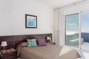 Ένα ή περισσότερα κρεβάτια σε δωμάτιο στο El Colomar