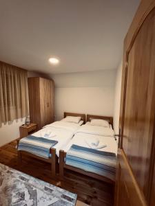 מיטה או מיטות בחדר ב-Guest House SARA