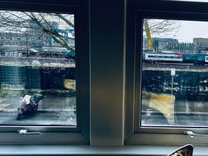 a toy motorcycle sitting in front of a window at Neils Place hosted by AirOperate in London