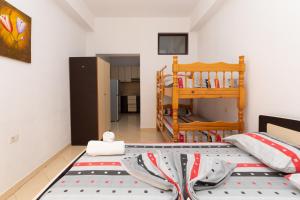 a bedroom with a bed and a bunk room at Sulo Villa in Vlorë