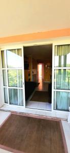 a room with sliding glass doors in a building at Super-cute colourful, cozy flat in Saint-Raphaël