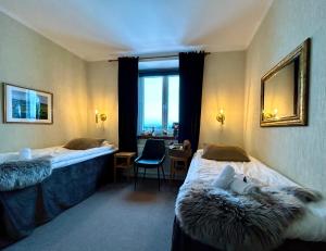 Postel nebo postele na pokoji v ubytování Kungshaga Hotell