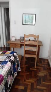 En eller flere senge i et værelse på Refúgio Aconchegante