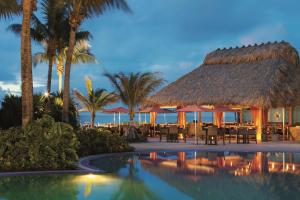 a resort with a pool and a restaurant with palm trees at The Ritz Carlton Key Biscayne, Miami in Miami
