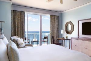 a hotel room with a large bed and a large window at The Ritz Carlton Key Biscayne, Miami in Miami