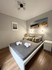 Postel nebo postele na pokoji v ubytování Apartamenty Baltic 16B/5