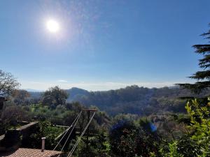 a view of a valley with the sun in the sky at Casa Tuoro in Furnolo +4 photos